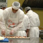 A prisoner prepares nibbles for the guests